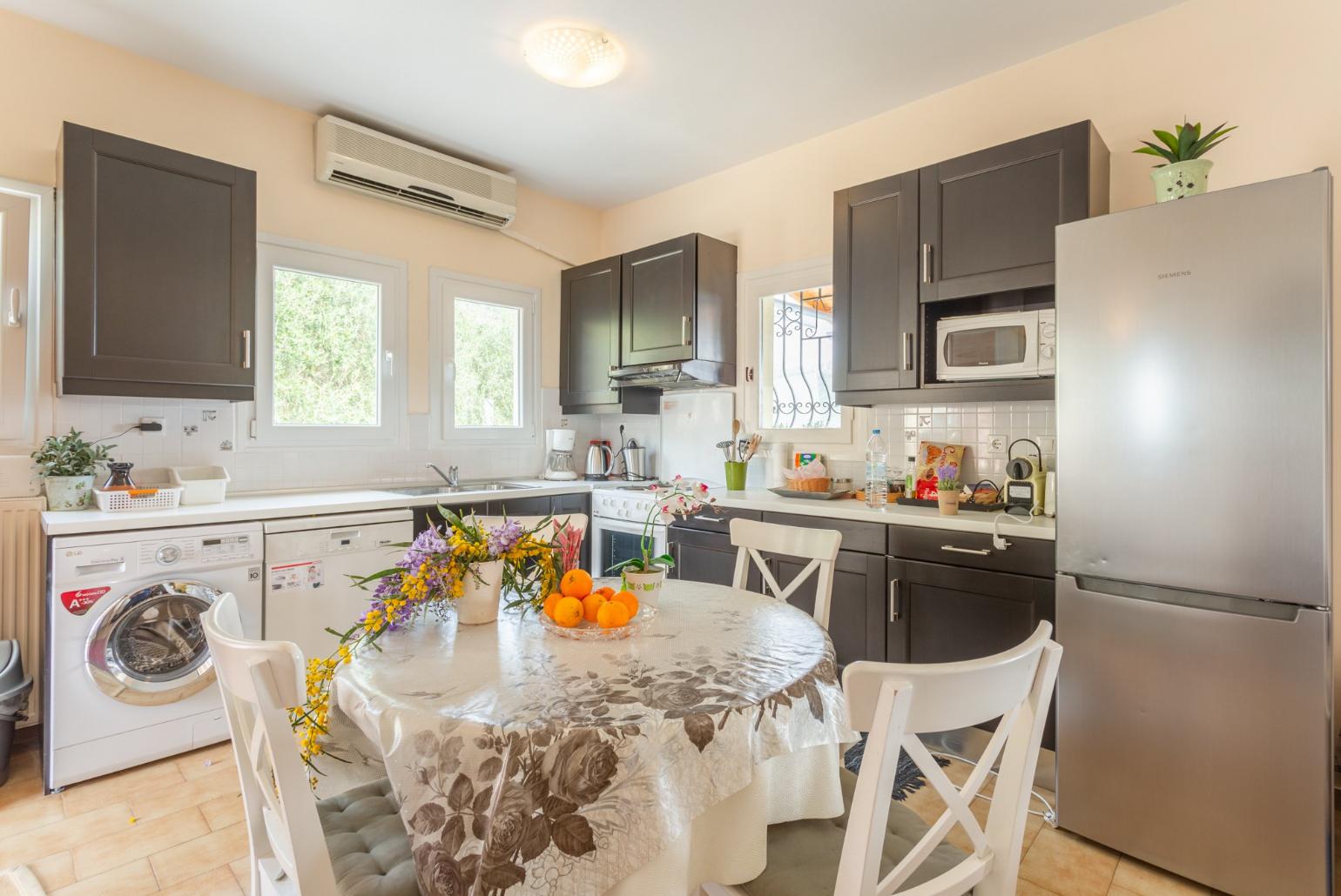 Equipped kitchen and dining area