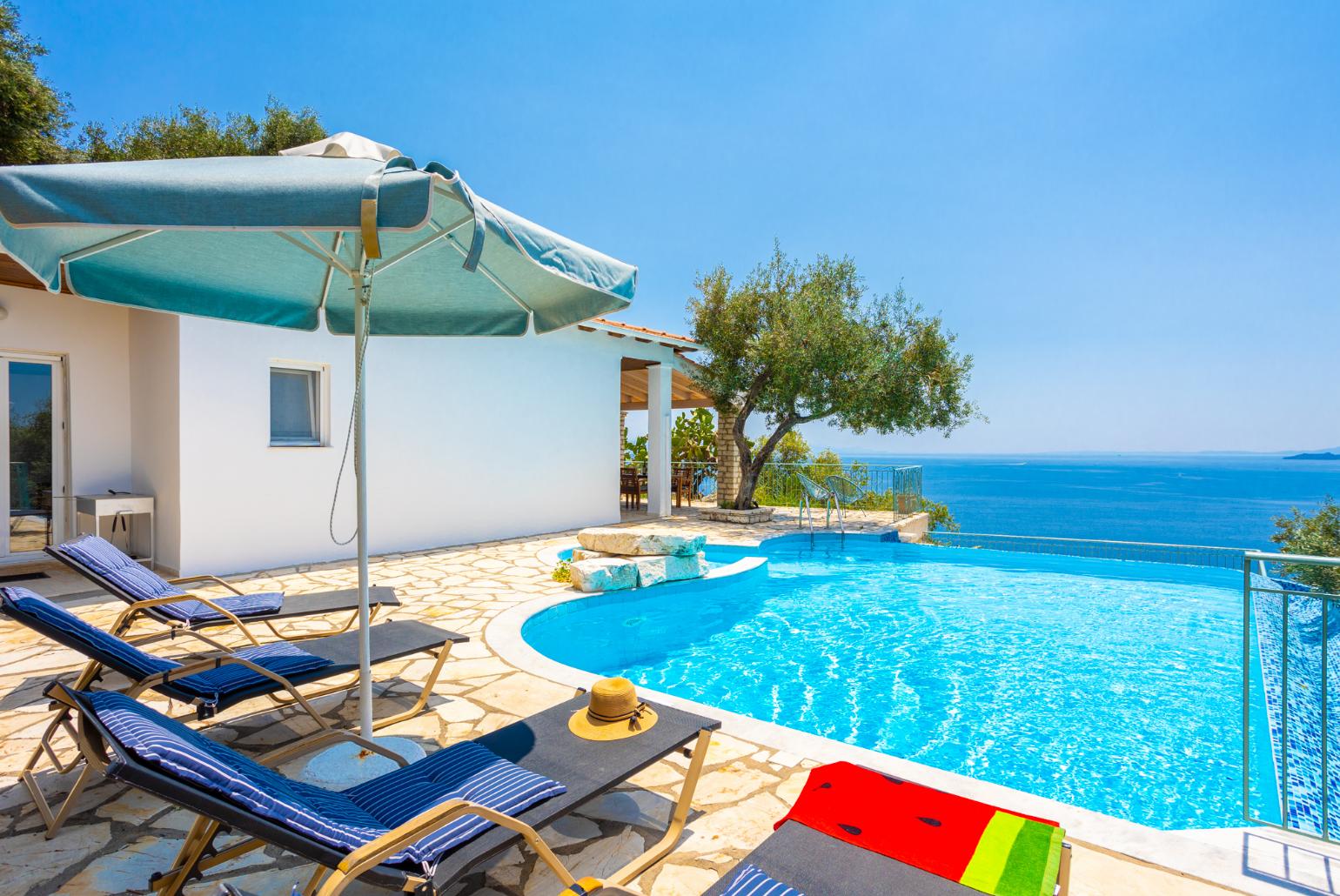 ,Beautiful villa with private infinity pool and terrace with sea views