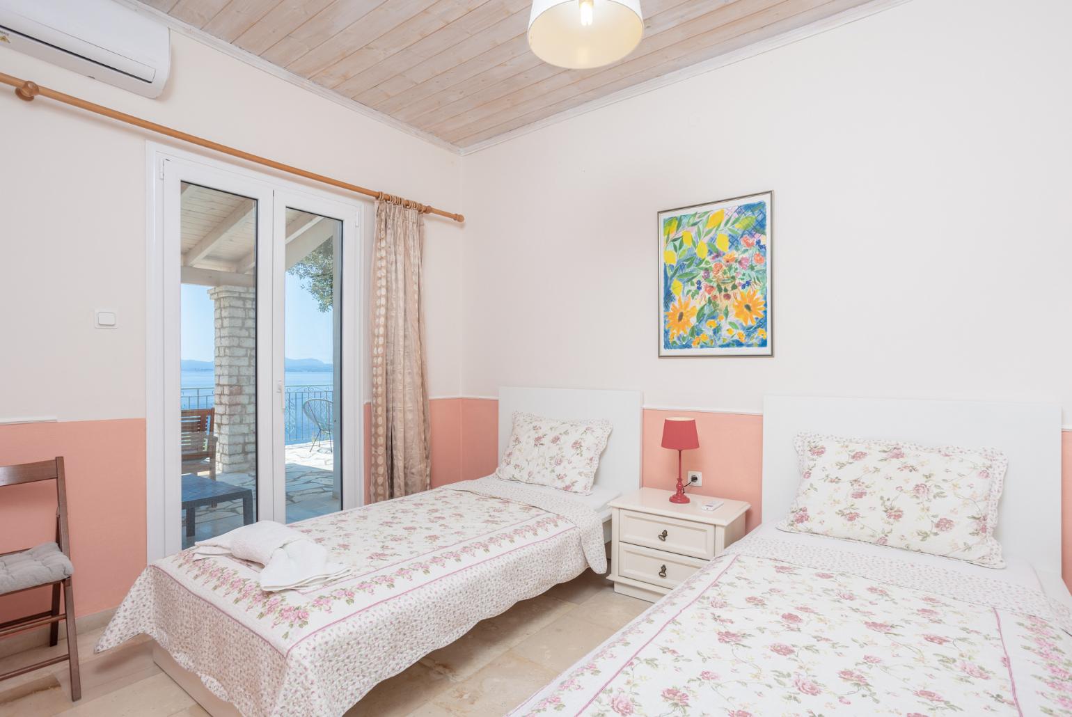 Twin bedroom with  A/C and terrace access with sea views