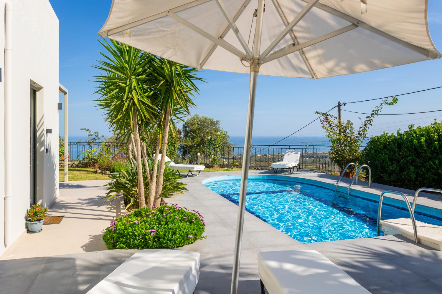 Private pool, terrace, and garden with sea views