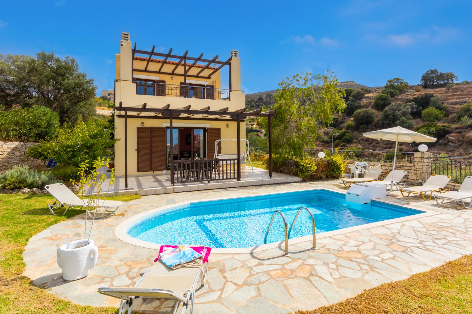 ,Beautiful villa with private pool, terrace, and garden with sea views