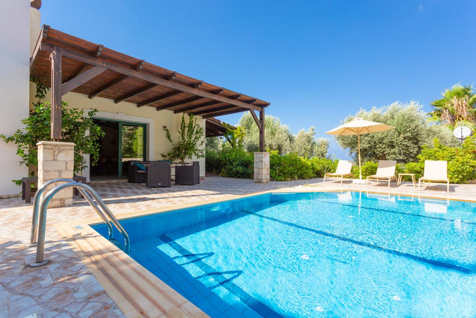 ,Beautiful villa with private pool, terrace, and lawn