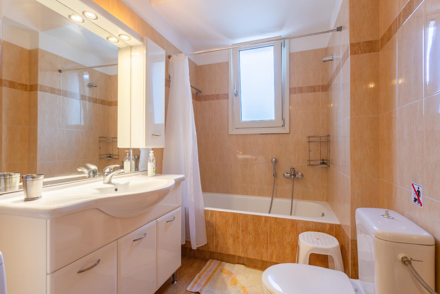 Family bathroom with bath and shower