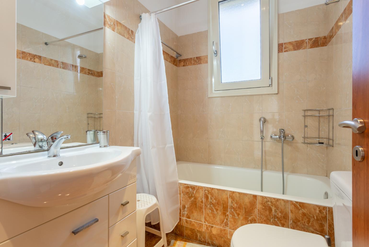 Family bathroom with bath and shower