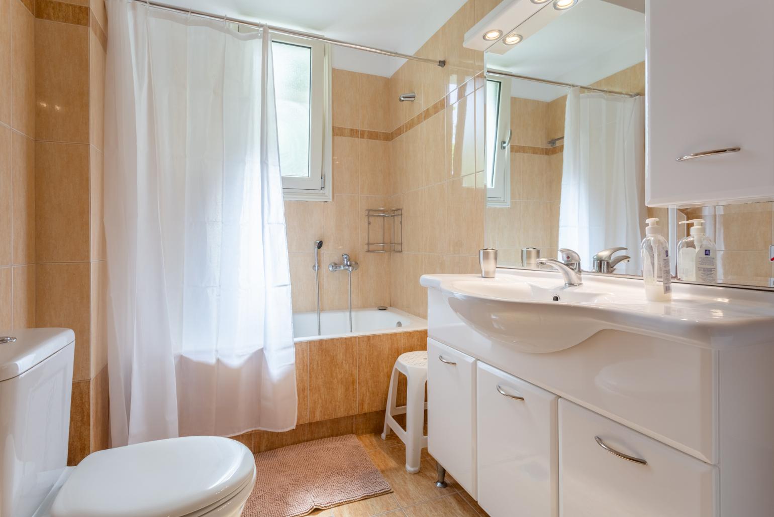 Family bathroom with bath and shower