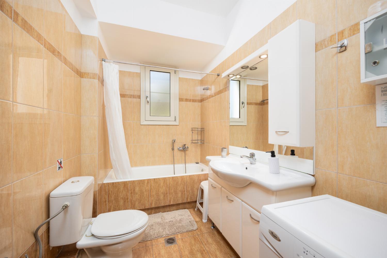 Family bathroom with bath and shower