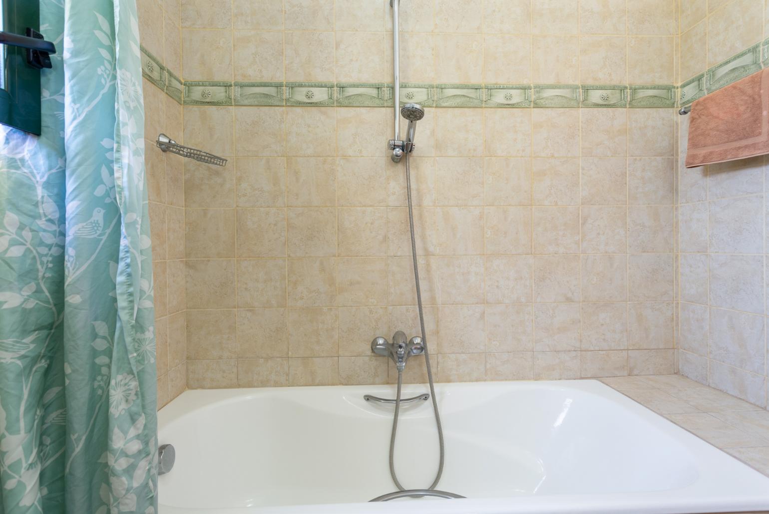 Family bathroom with bath and shower