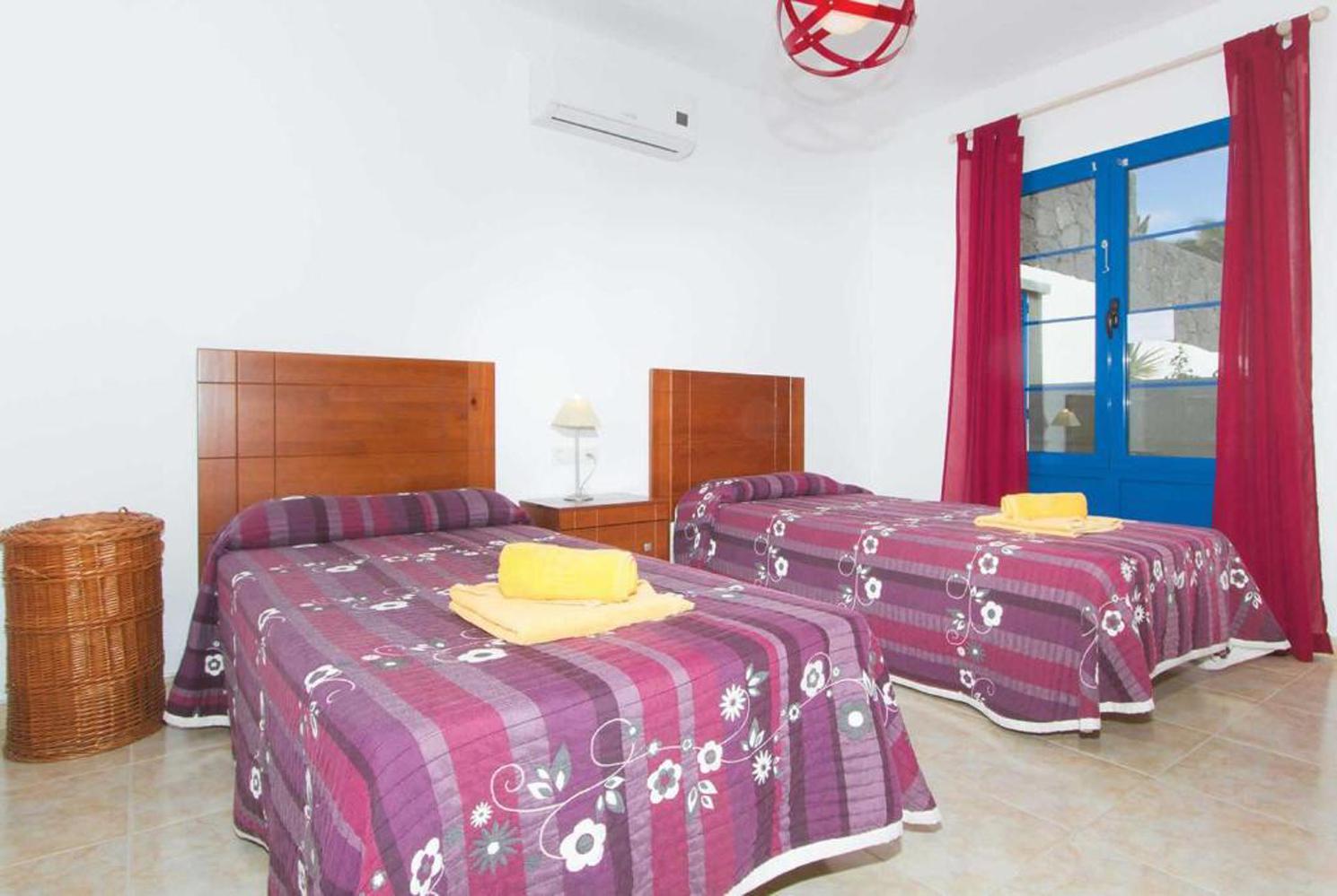 Twin beds bedroom with A/C and terrace access