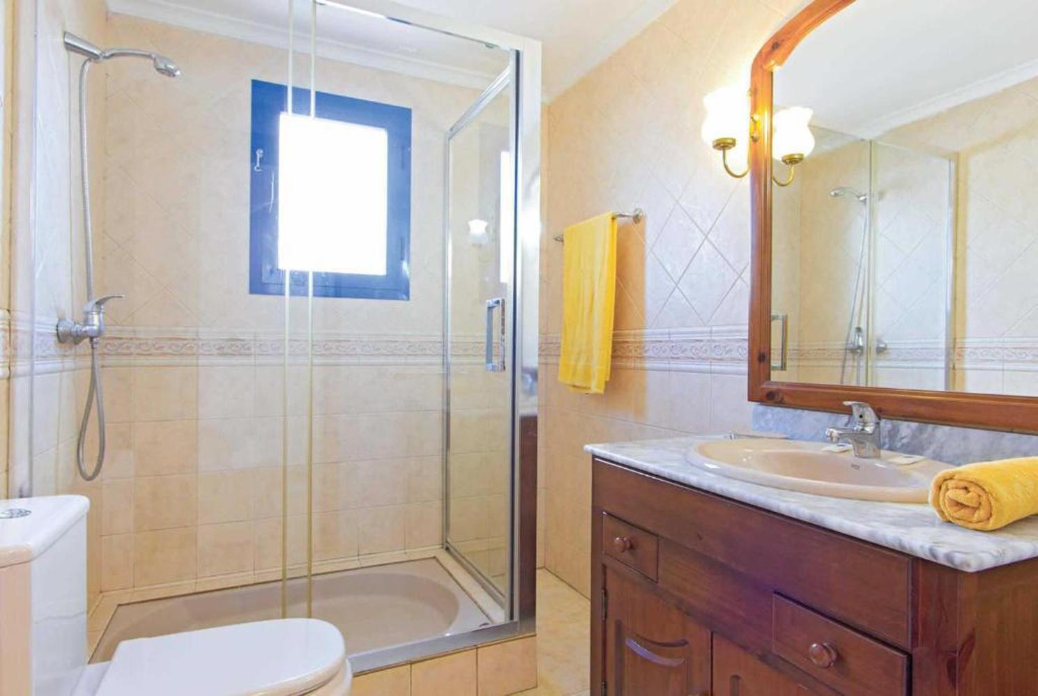 En suite bathroom with shower and WC