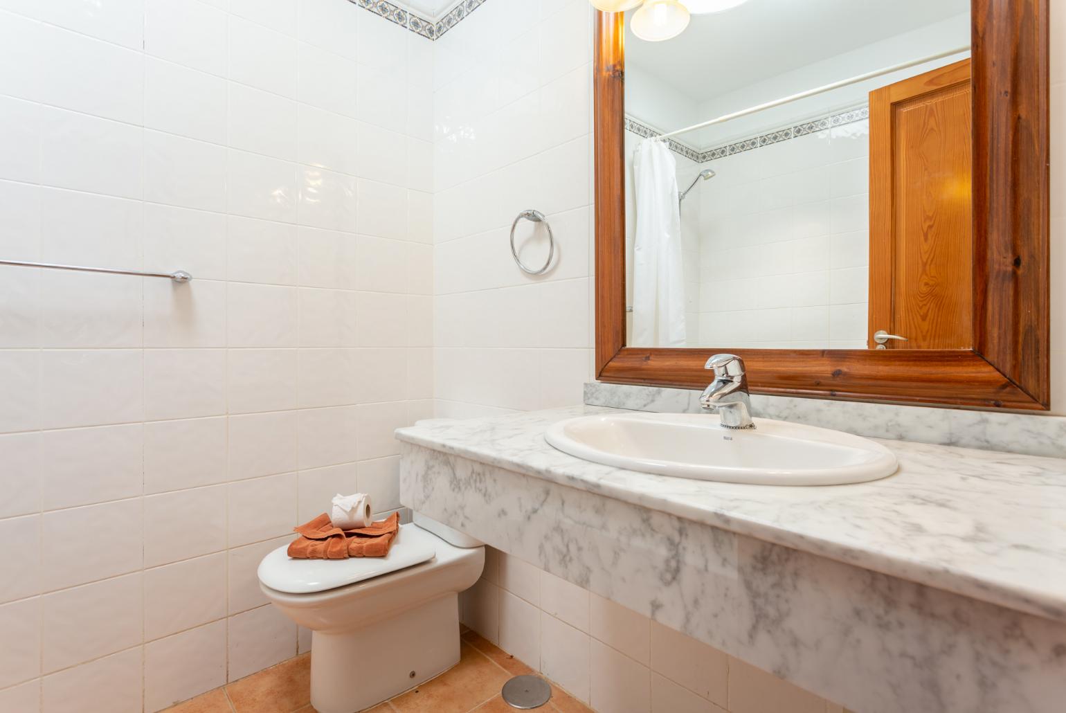 Family bathroom with bath and shower