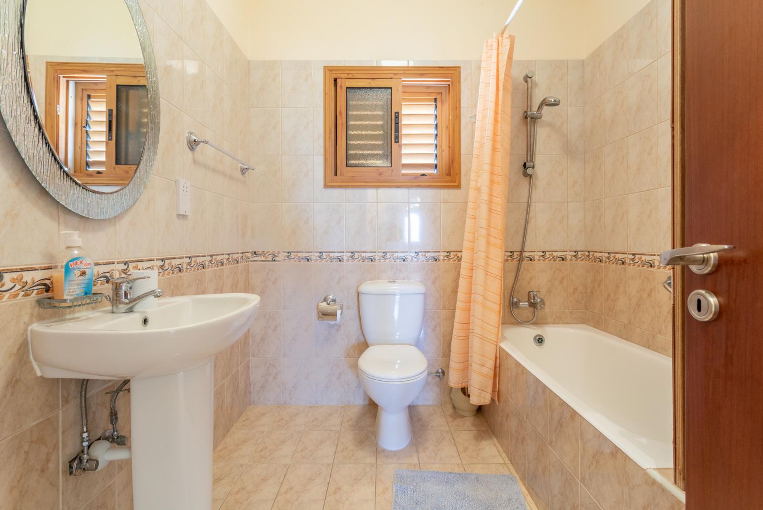 Family bathroom with bath and shower
