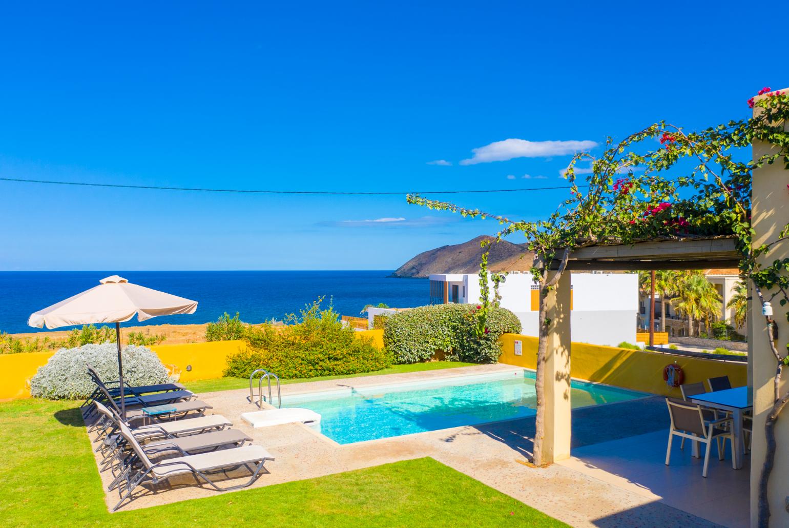 Private pool, terrace, and garden with panoramic sea views