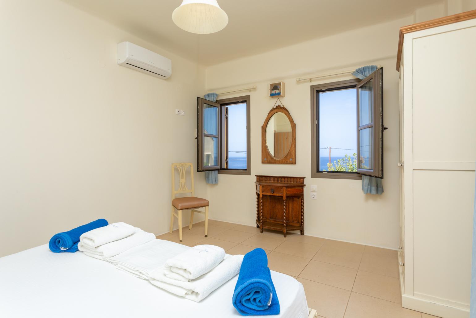 Double bedroom with A/C and balcony access with sea views