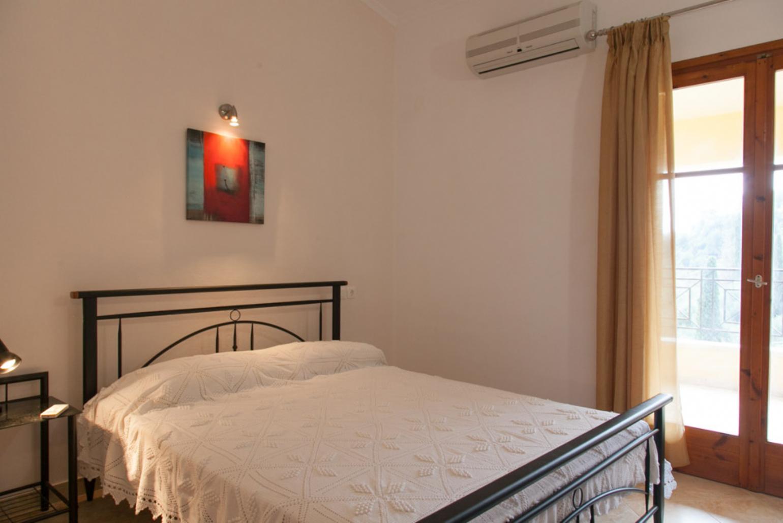 Double bedroom with A/C, balcony access and en suite bathroom 