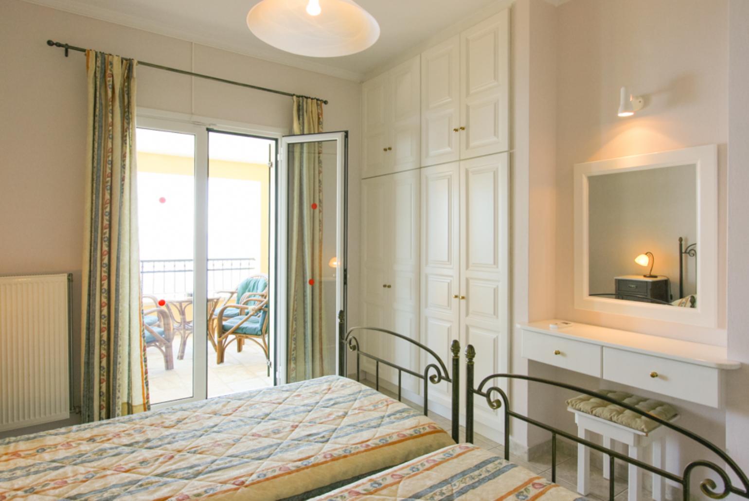 Twin bedroom with A/C, balcony access and e suite bathroom