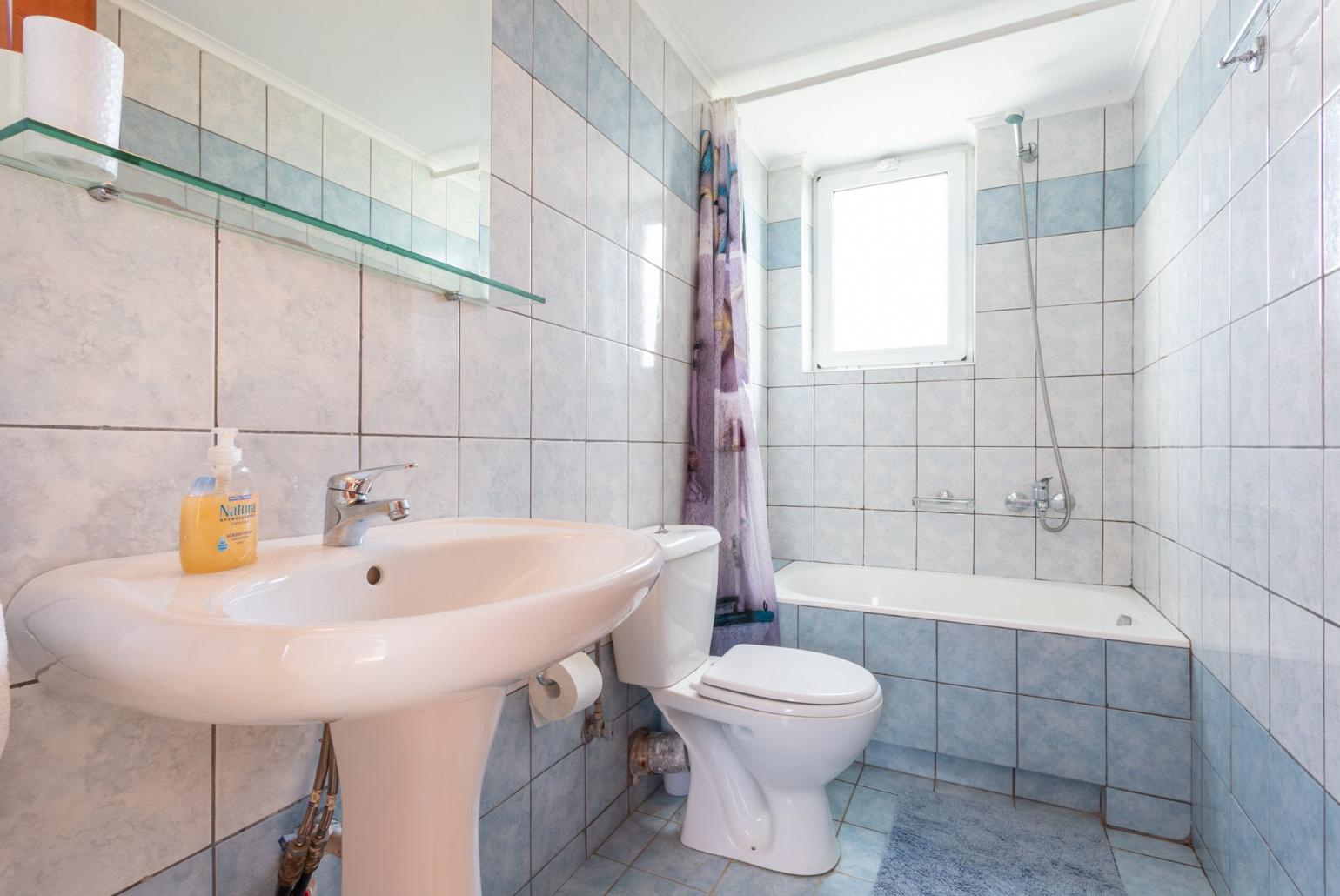 Family bathroom with bath and shower