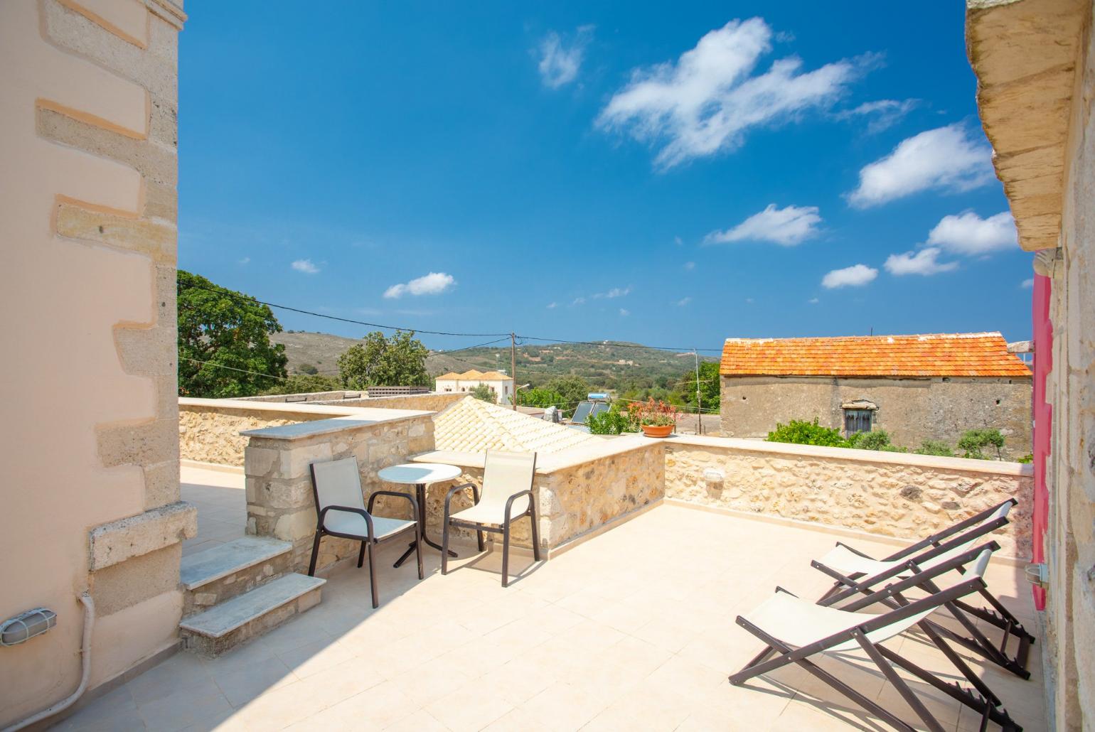 Outdoor seating on upper terrace area