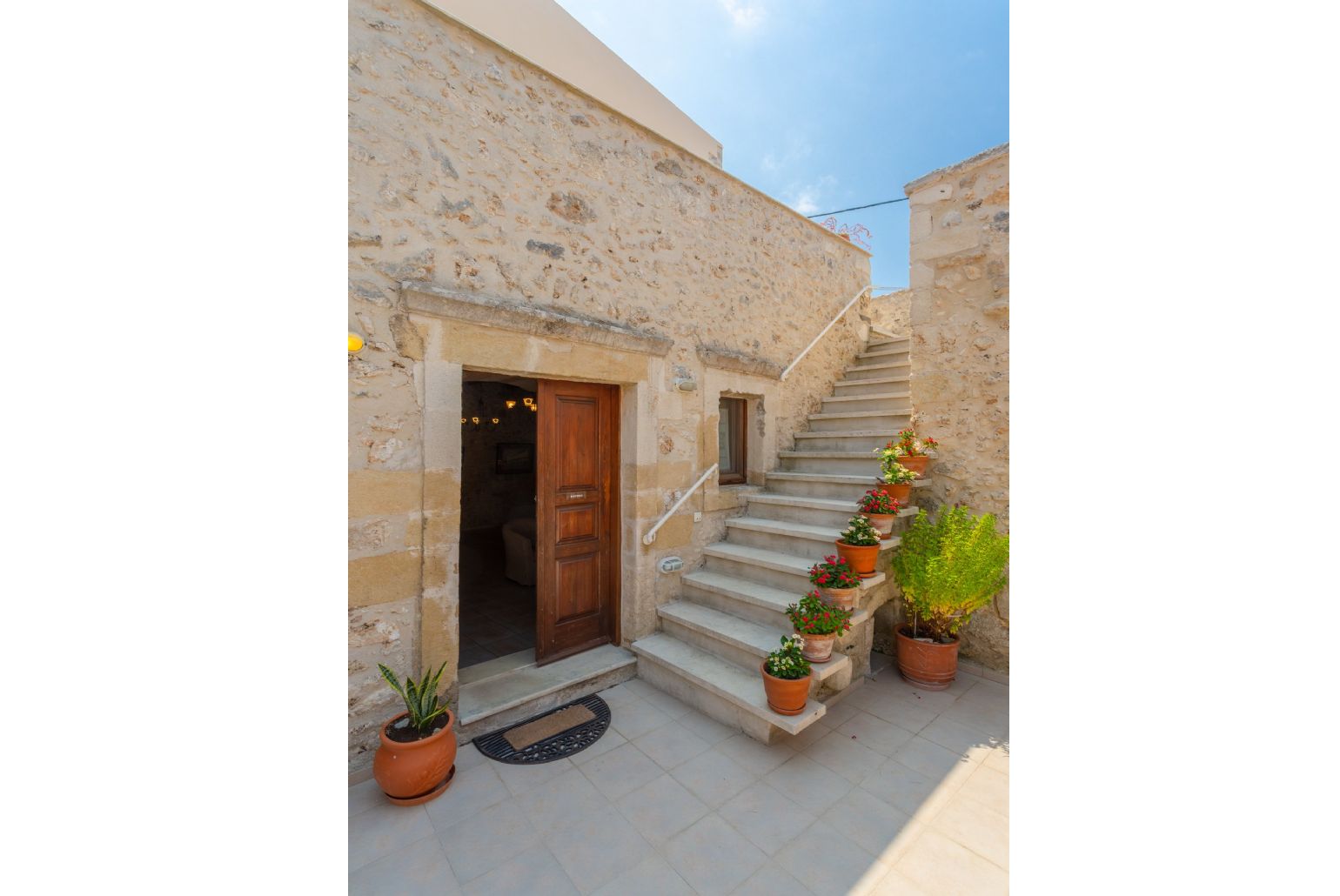 Stairs from pool terrace to upper terrace