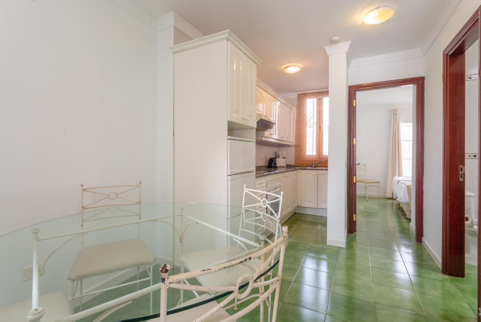 Dining area and equipped kitchen