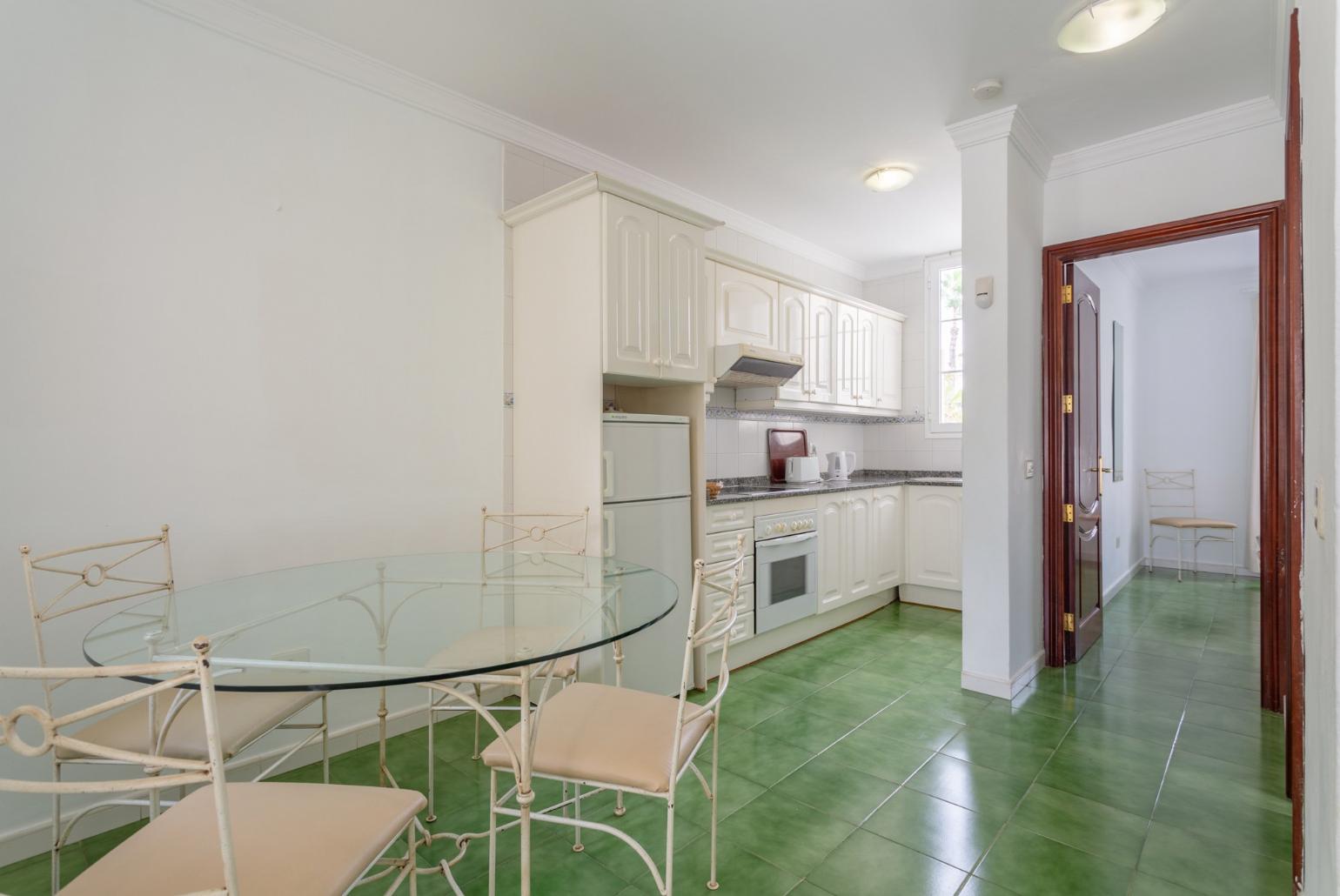 Dining area and equipped kitchen