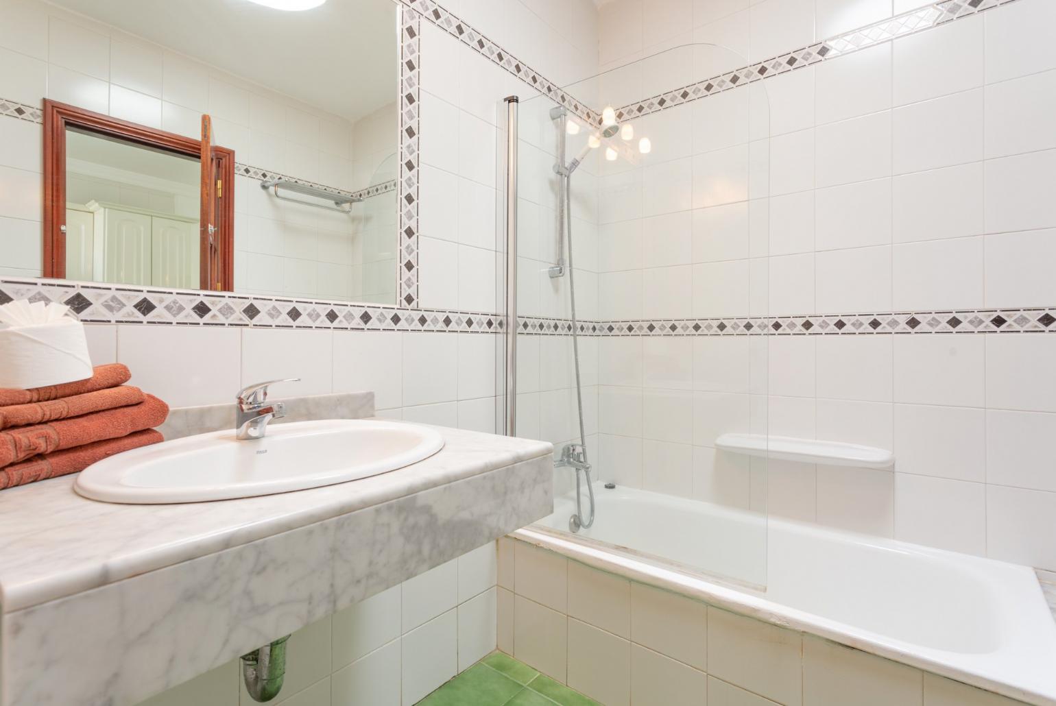 Family bathroom with shower and bath