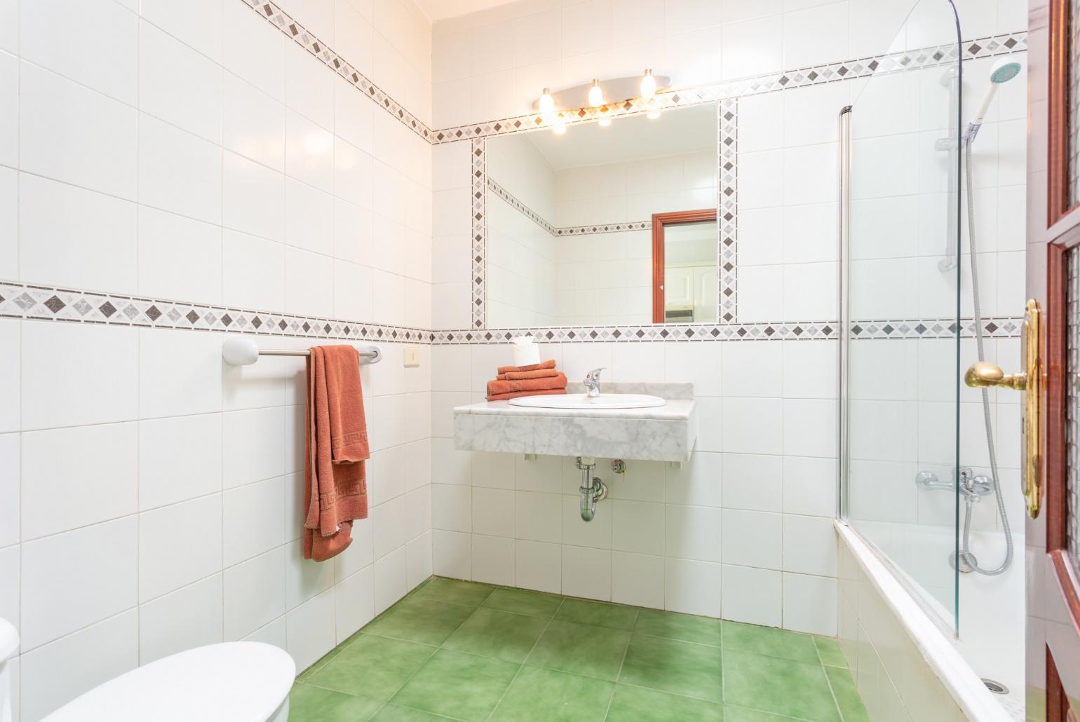 Family bathroom with shower and bath