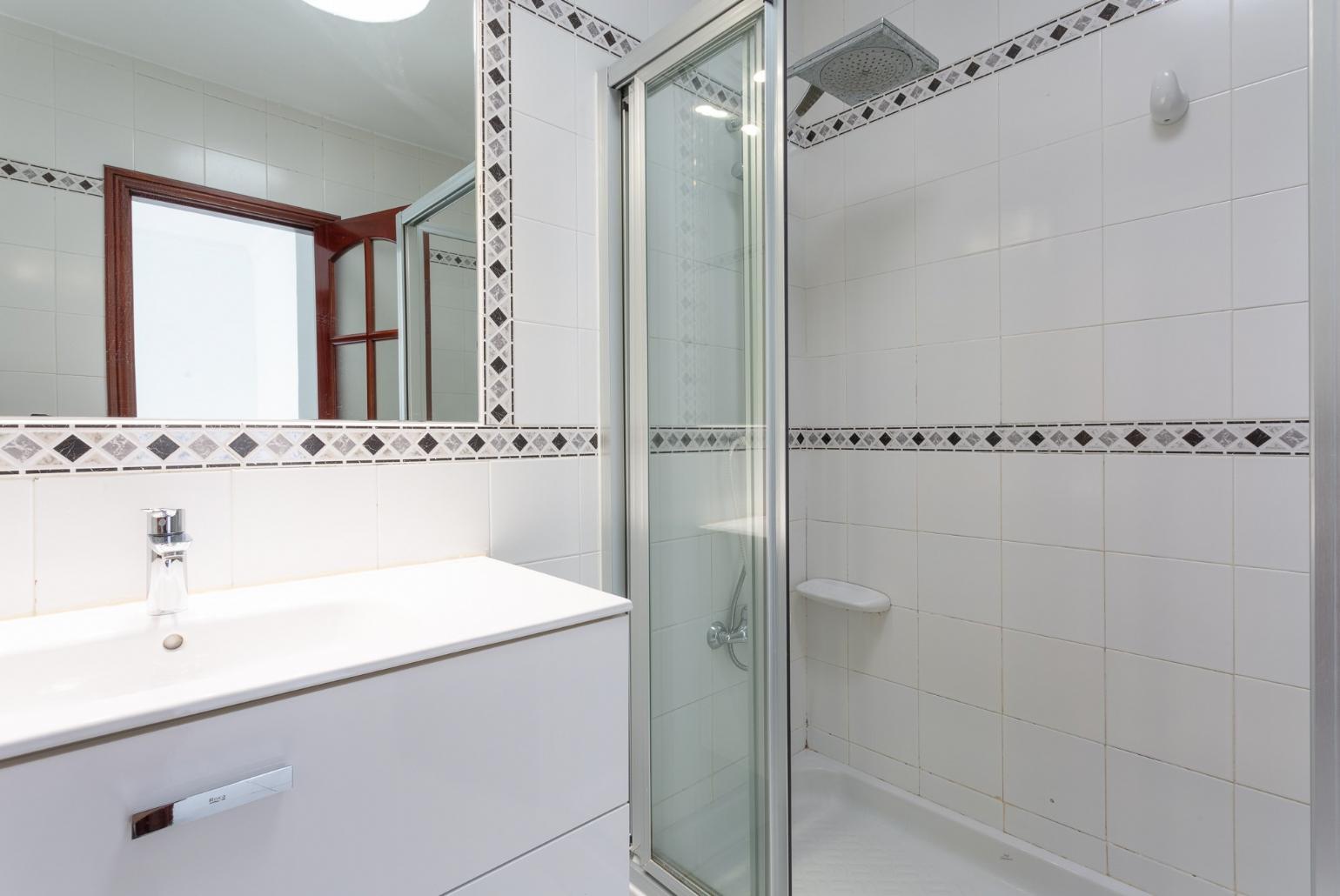 Family bathroom with overhead shower