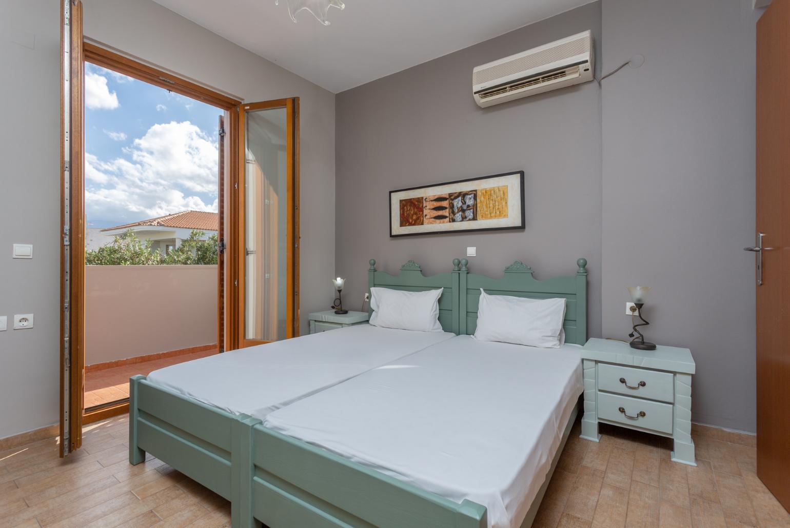 Twin bedroom with A/C and balcony access