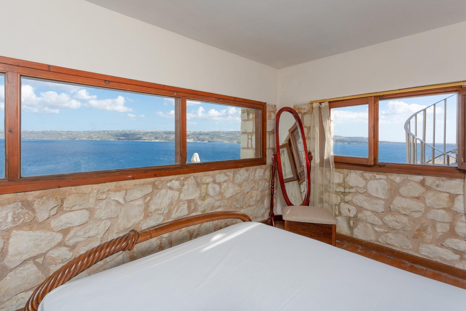 Double bedroom on mezzanine of self-contained apartment with panoramic sea views