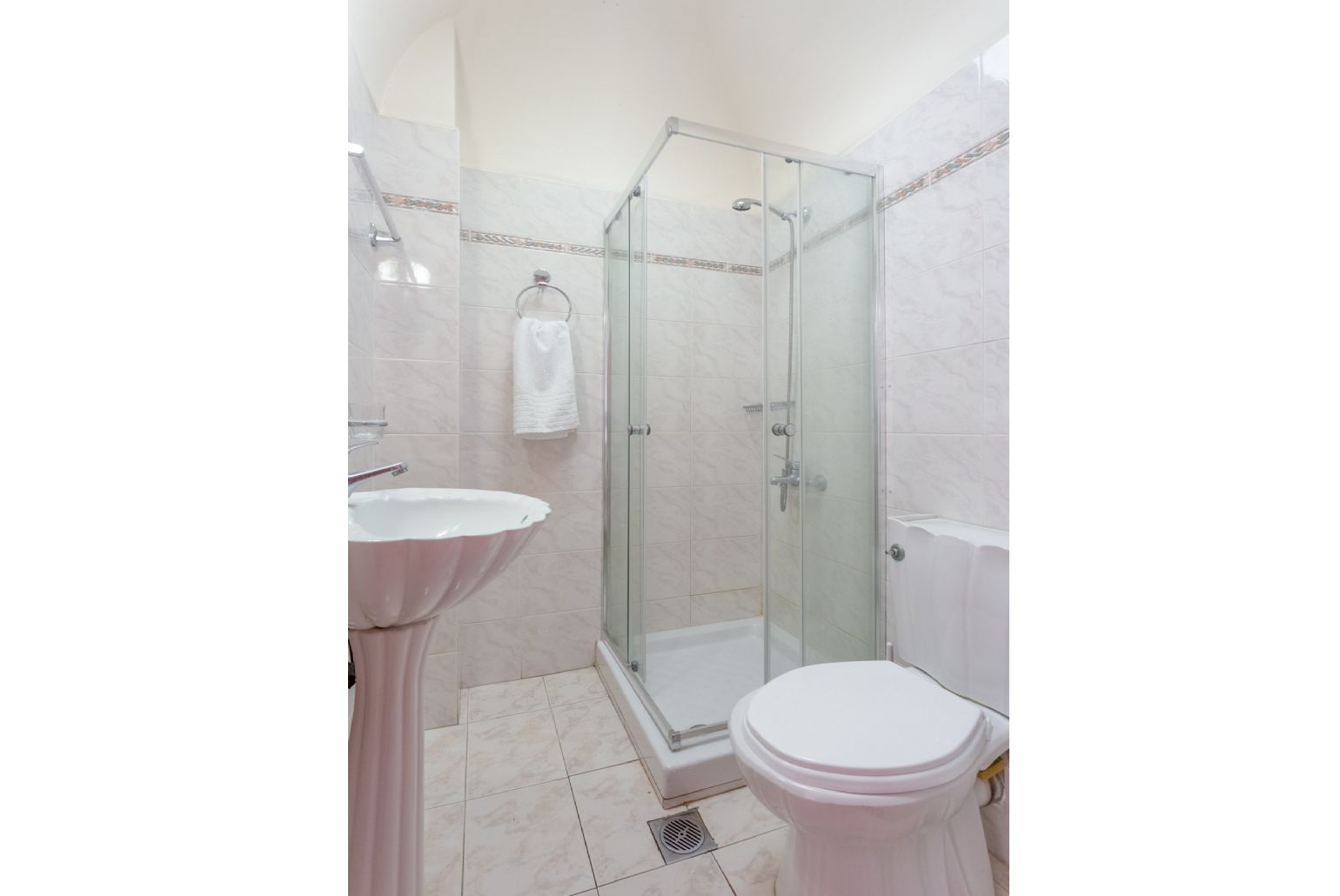 Family bathroom on ground floor with overhead shower