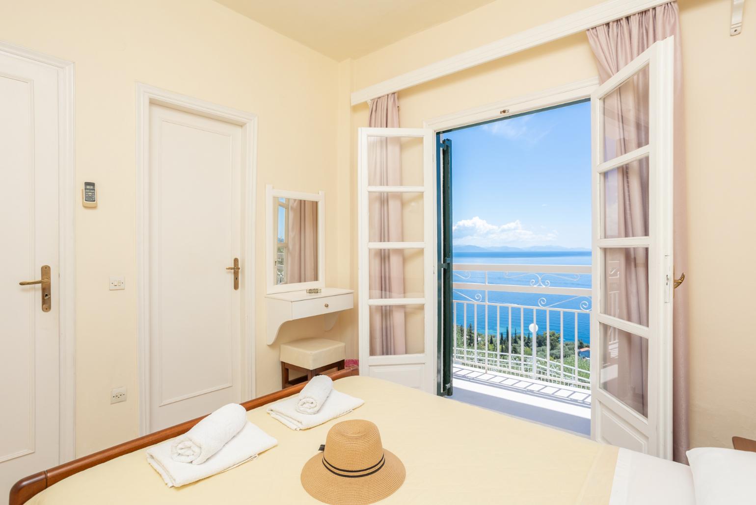 Double bedroom with en suite bathroom, A/C, and sea views