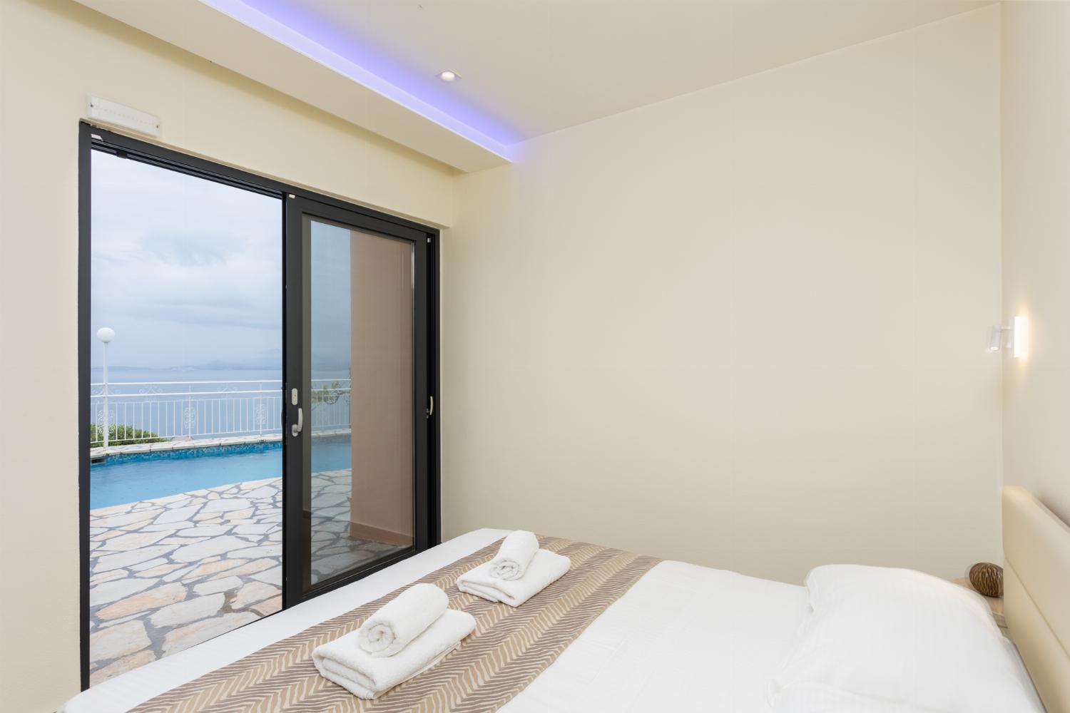 Double bedroom with en suite bathroom, A/C, sea views, and pool terrace access