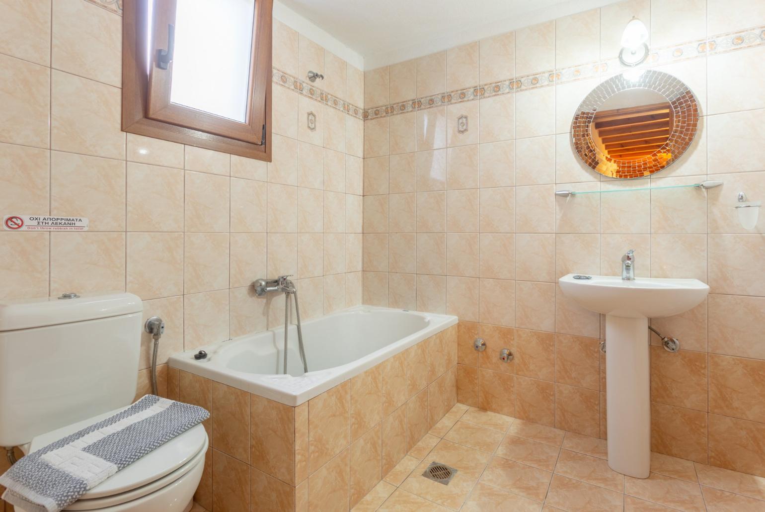 Family bathroom with bath and shower