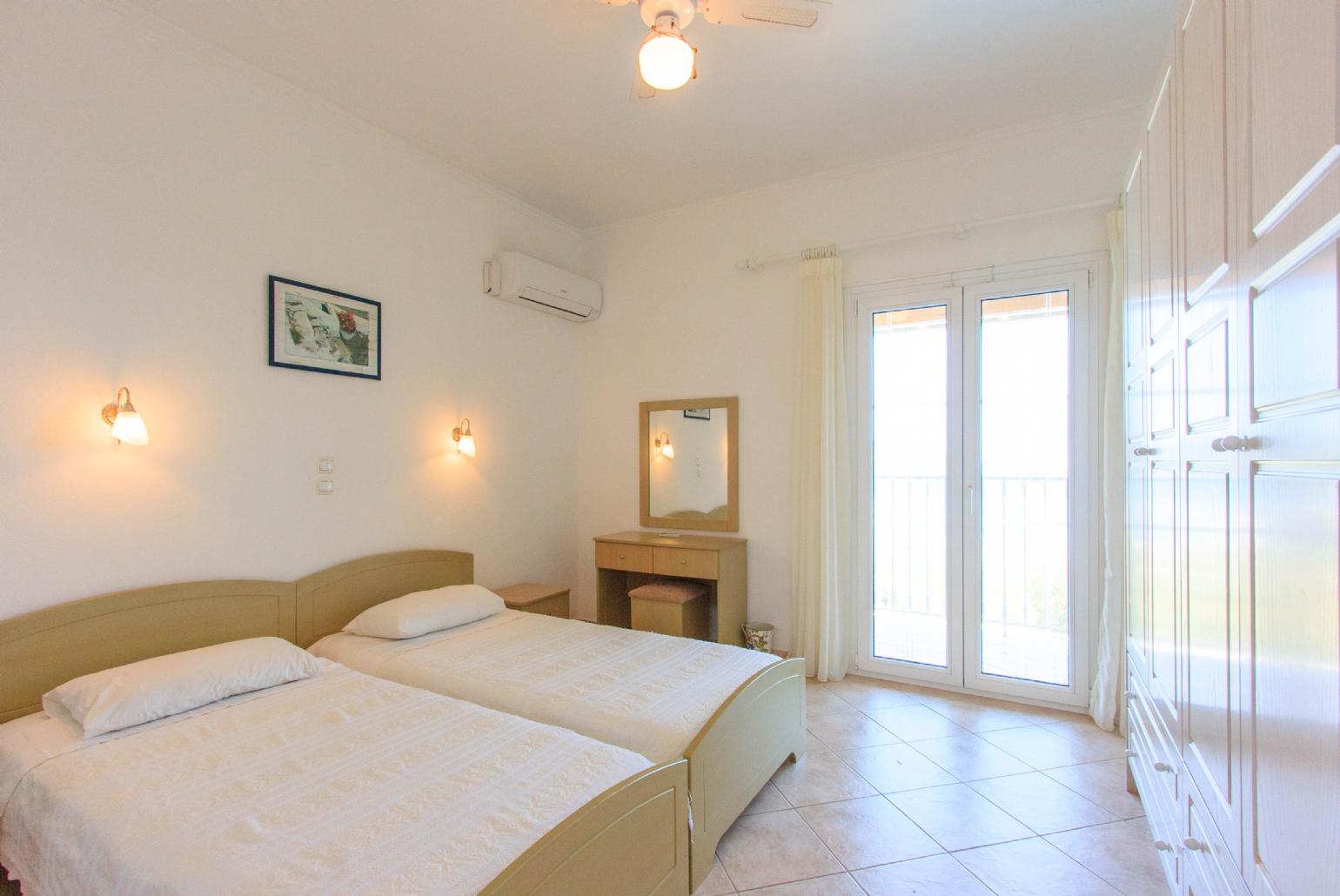 Twin bedroom with A/C and balcony access