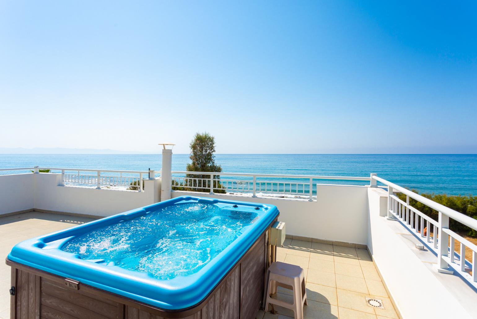 Roof terrace area with jacuzzi and panoramic sea views