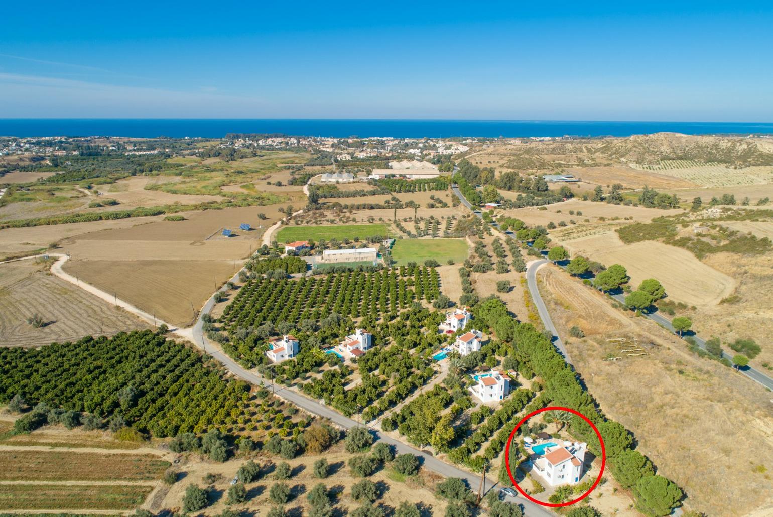 Aerial view showing location of Villa Charoula Ena and view towards sea