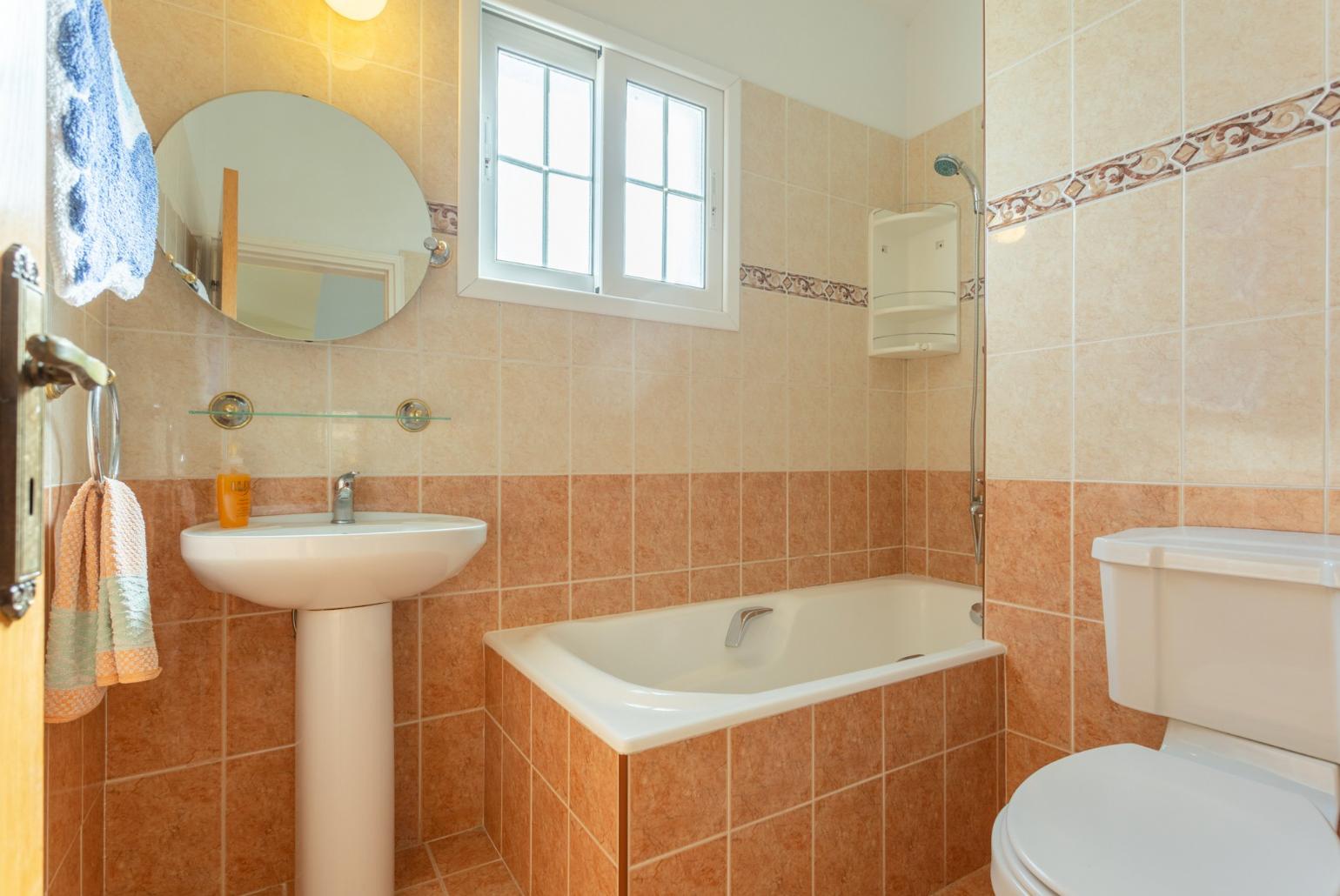 Family bathroom with bath and shower