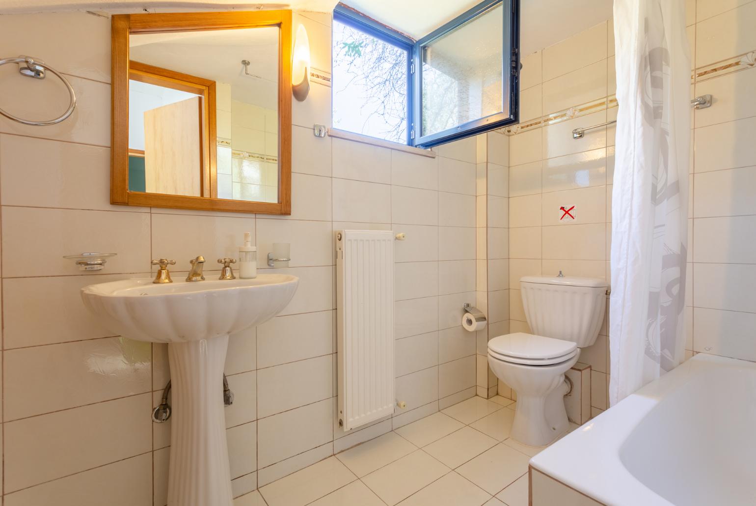 Family bathroom with bath and shower