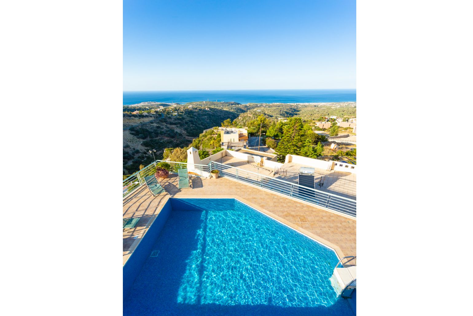 View of pool and terrace from balcony