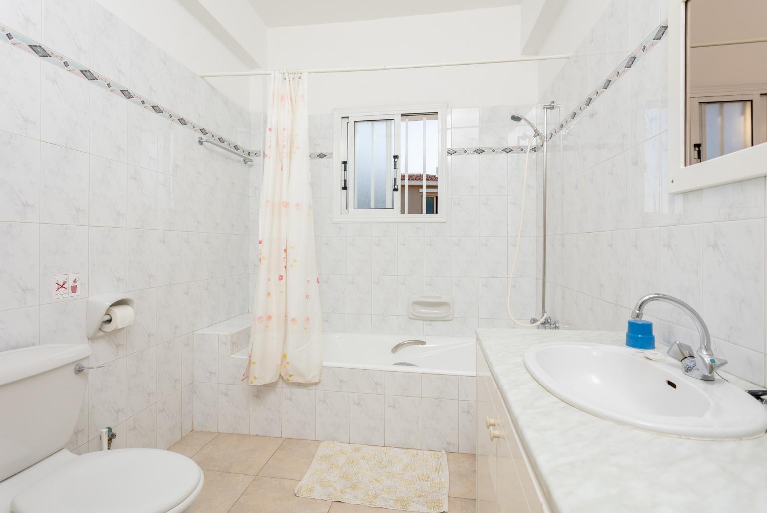 Family bathroom with bath and shower