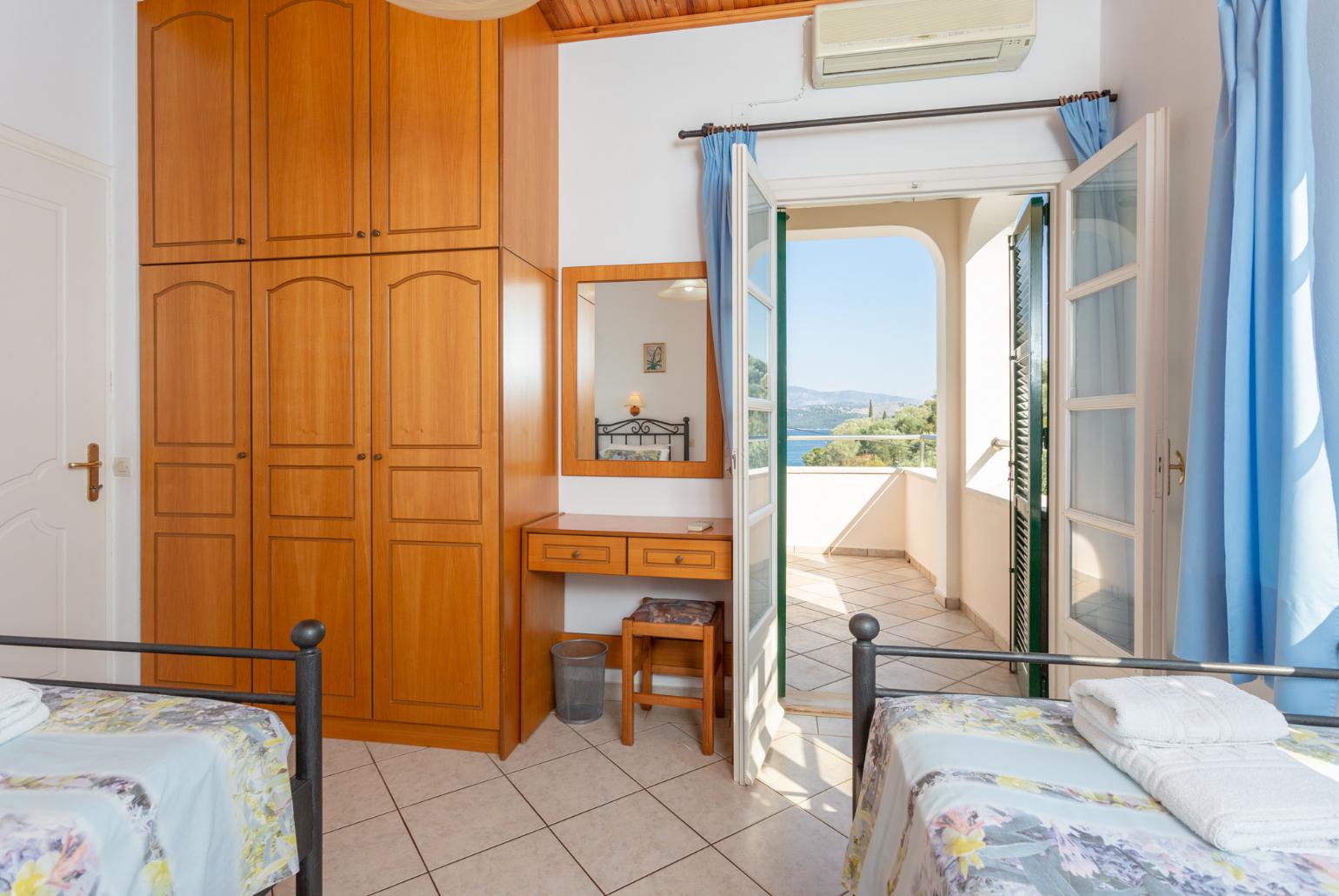 Twin bedroom with A/C, and terrace access with sea views