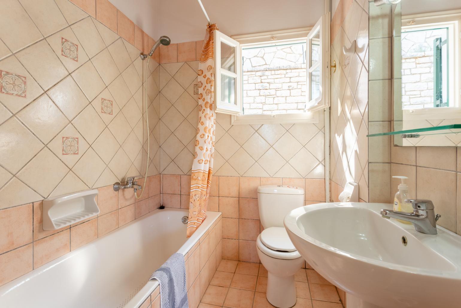 Family bathroom with bath and shower