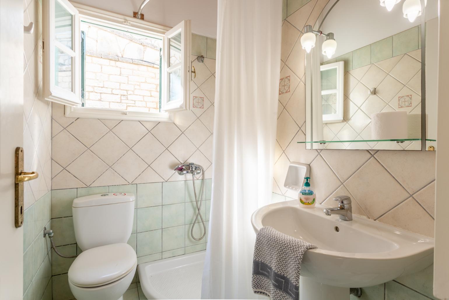 Family bathroom with bath and shower