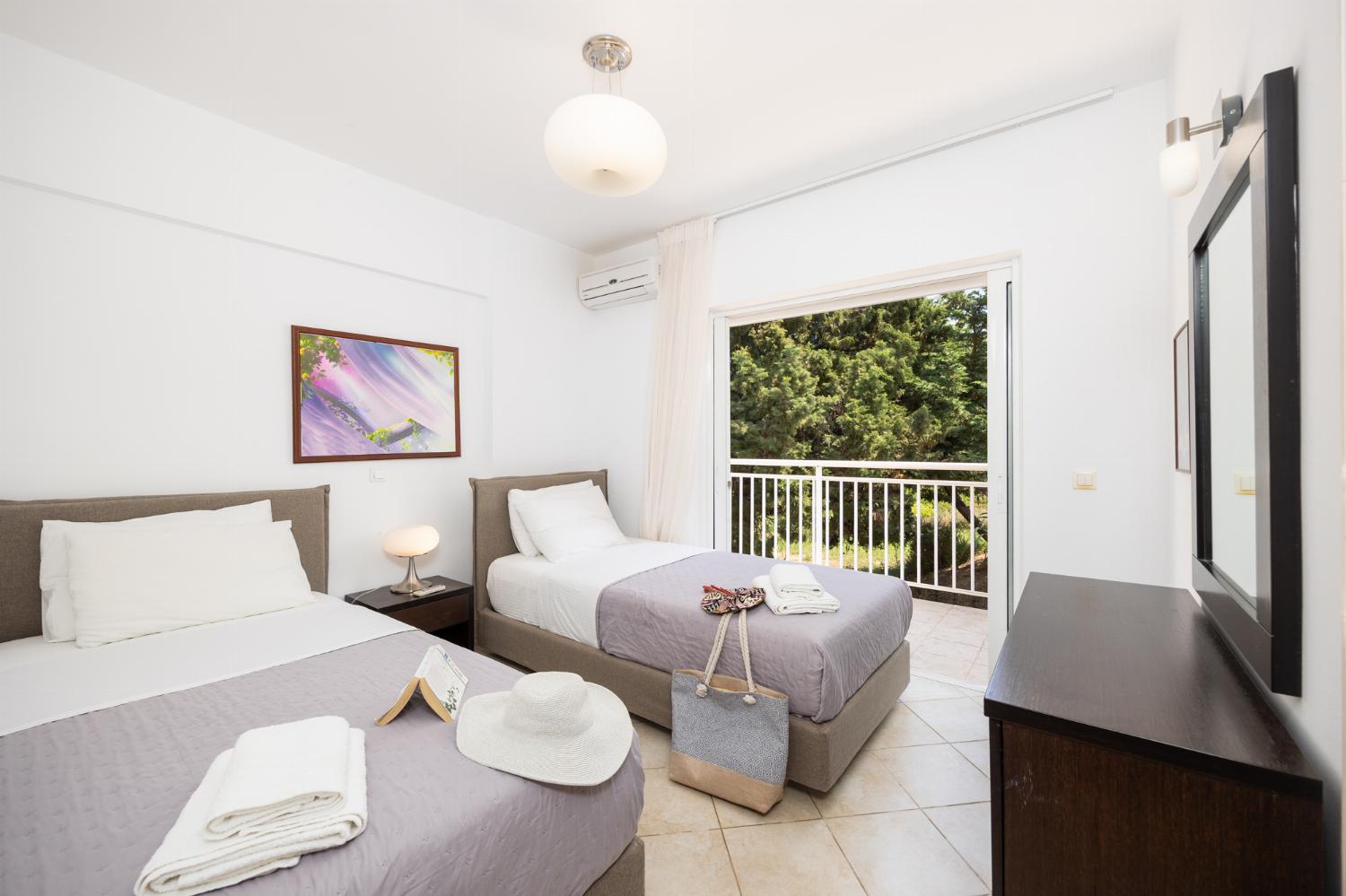 Twin bedroom with en suite bathroom and A/C