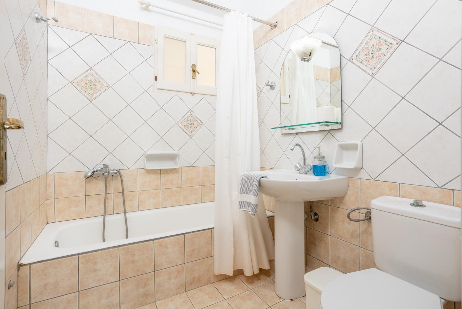 Family bathroom with bath and shower