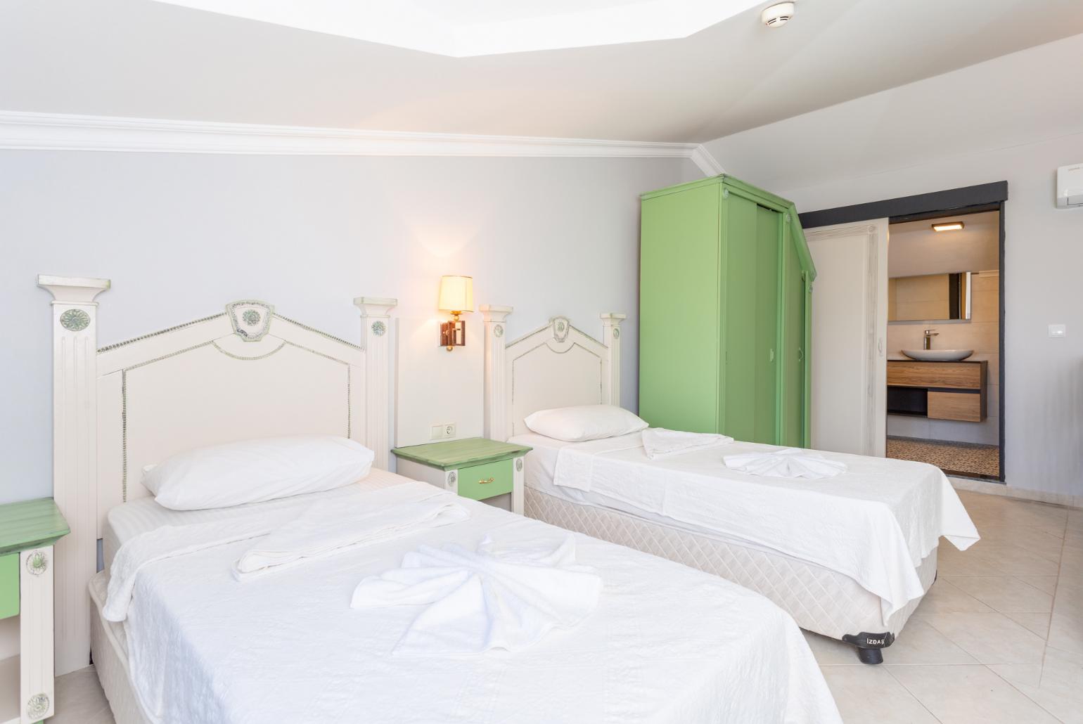 Twin bedroom with en suite bathroom and A/C