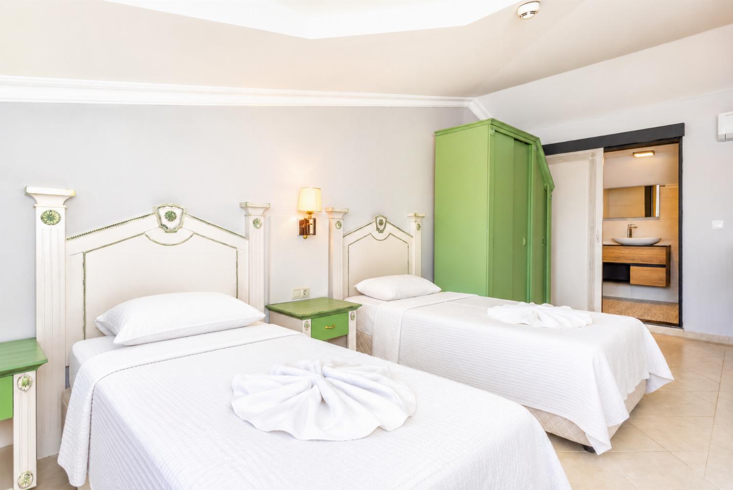 Twin bedroom with en suite bathroom and A/C