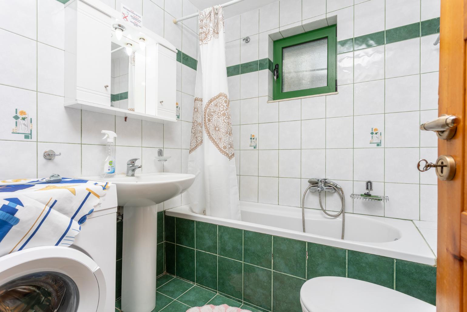 Family bathroom with bath and shower