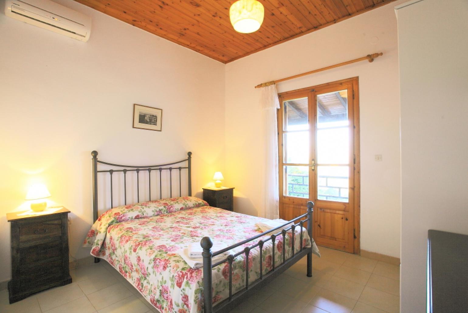 Double bedroom with A/C and balcony access