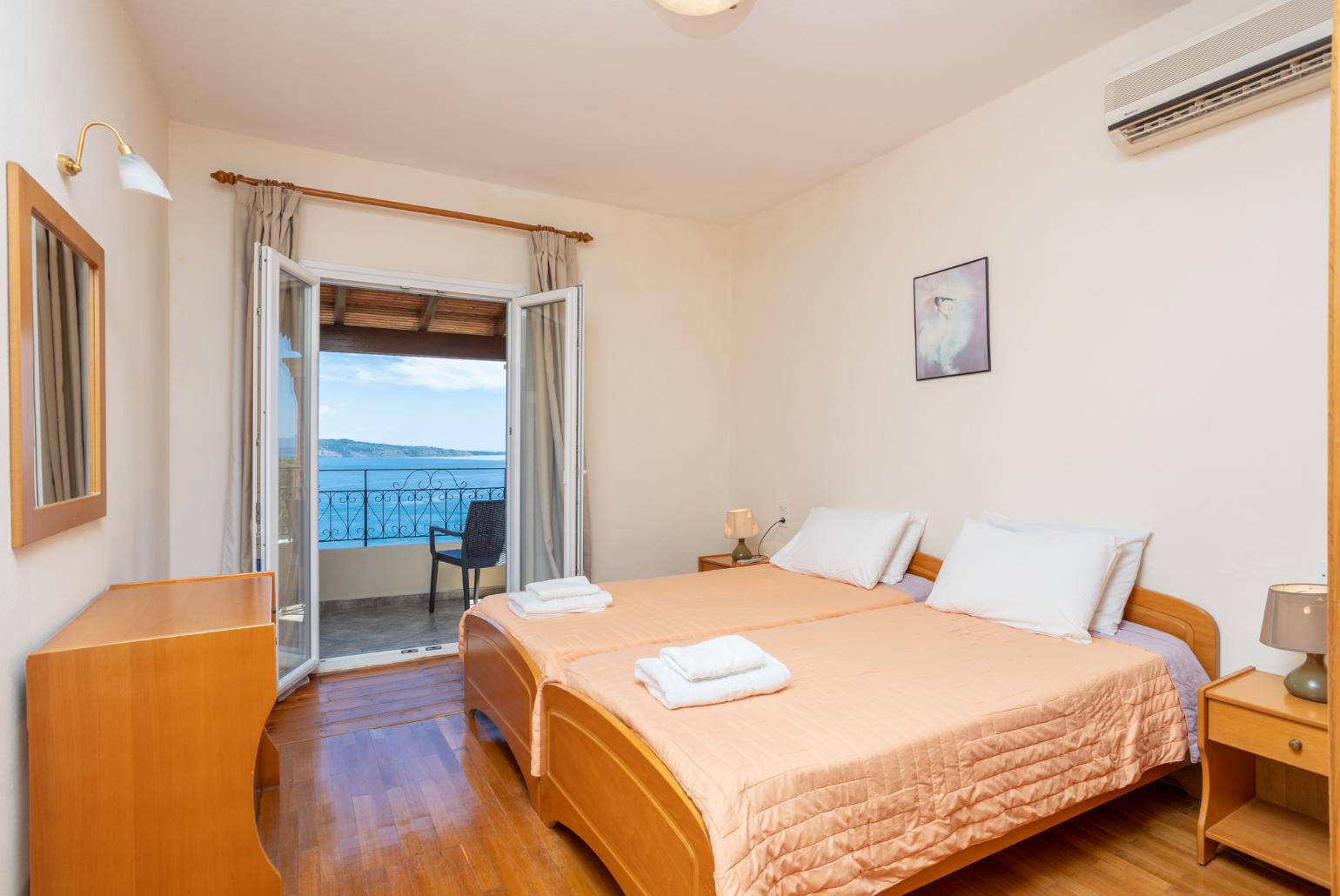 Twin bedroom with A/C and balcony access with panoramic sea views